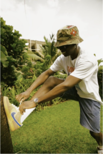 Rema in a bucket hat